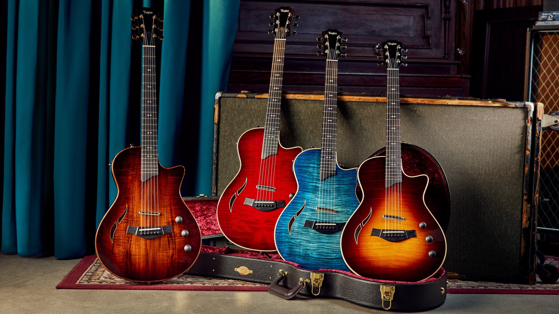 Header image of four Taylor T5z guitars in natural koa, red, blue, and Tobacco Sunburst colors in a music venue setting