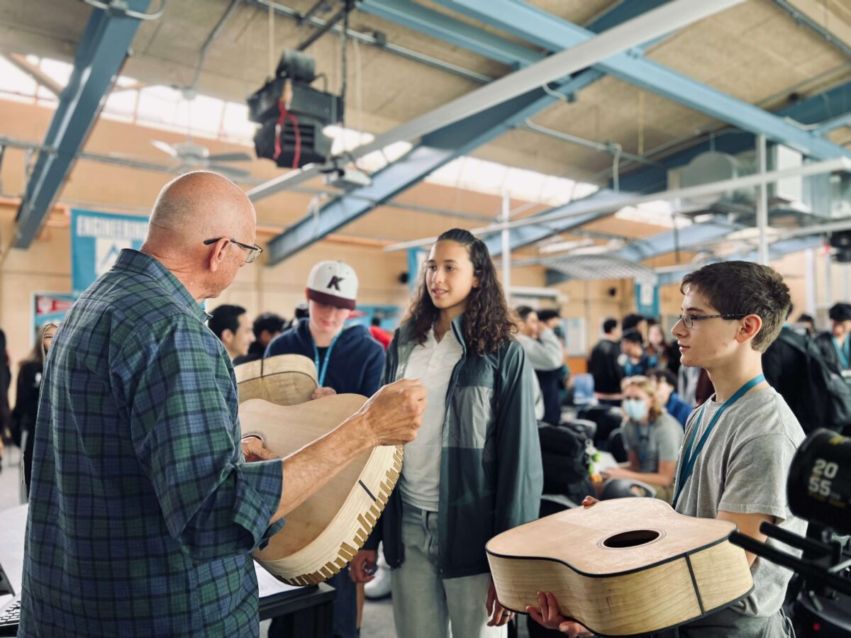 Bob Taylor talks to high school students in wood shop class